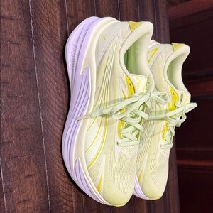 Puma women’s Lightweight Running Sneakers in Pale Yellow with White Sole